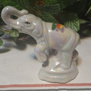Iridescent Elephant Figurine with Fruit Design